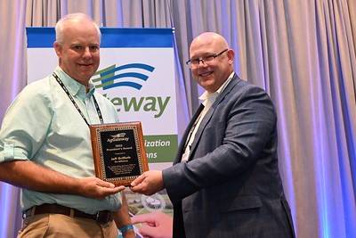 Co-Alliance Cooperative’s Jeff Griffeth (left) receives the President’s Award from Brent Kemp, AgGateway President and CEO.